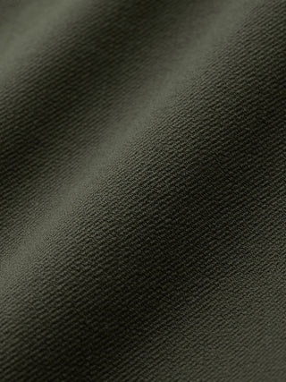 Nærbillede af det olivengrønne twill-stof på GEN2™-shortsene i farven »Muted Green«.