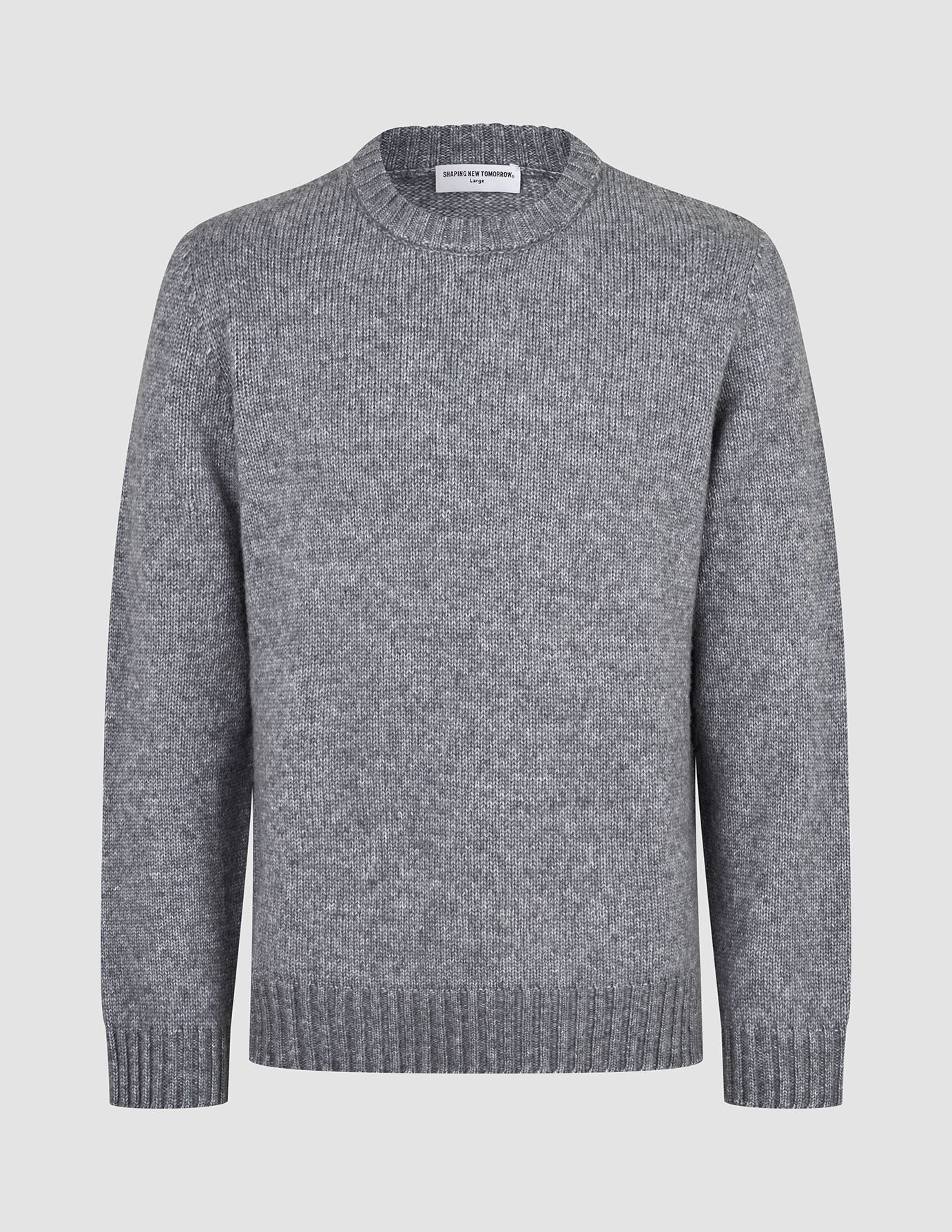 Tykt, blødt uldstrikket sweater med rund hals i farven Glacier Grey, med grov struktur og ribkant ved ærmerne og forneden.