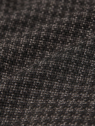 Nærbillede af Timeless Wool Blazer Slim Dark Brown Check, der viser en mørkebrun uldblanding med et diskret ternet mønster.