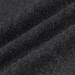 Nærbillede af Atelier Pants Relaxed Dark Grey i et mørkegråt stof med brudt twill-vævning og en struktureret, strikagtig overflade.
