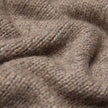 Nærbillede af et taupefarvet, groftstrikket merinouldstof fra damecardiganen Chunky Soft Wool Knit Cardigan Taupe Melange.