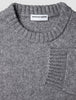 Tyk, blød uldstrikket sweater med rund hals i farven Glacier Grey, ribkant ved hals og manchetter samt et indvendigt logo-mærke.