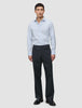 En mand iført en Elevated Shirt Regular Classic Blue Striped, mørke bukser og sorte loafers.