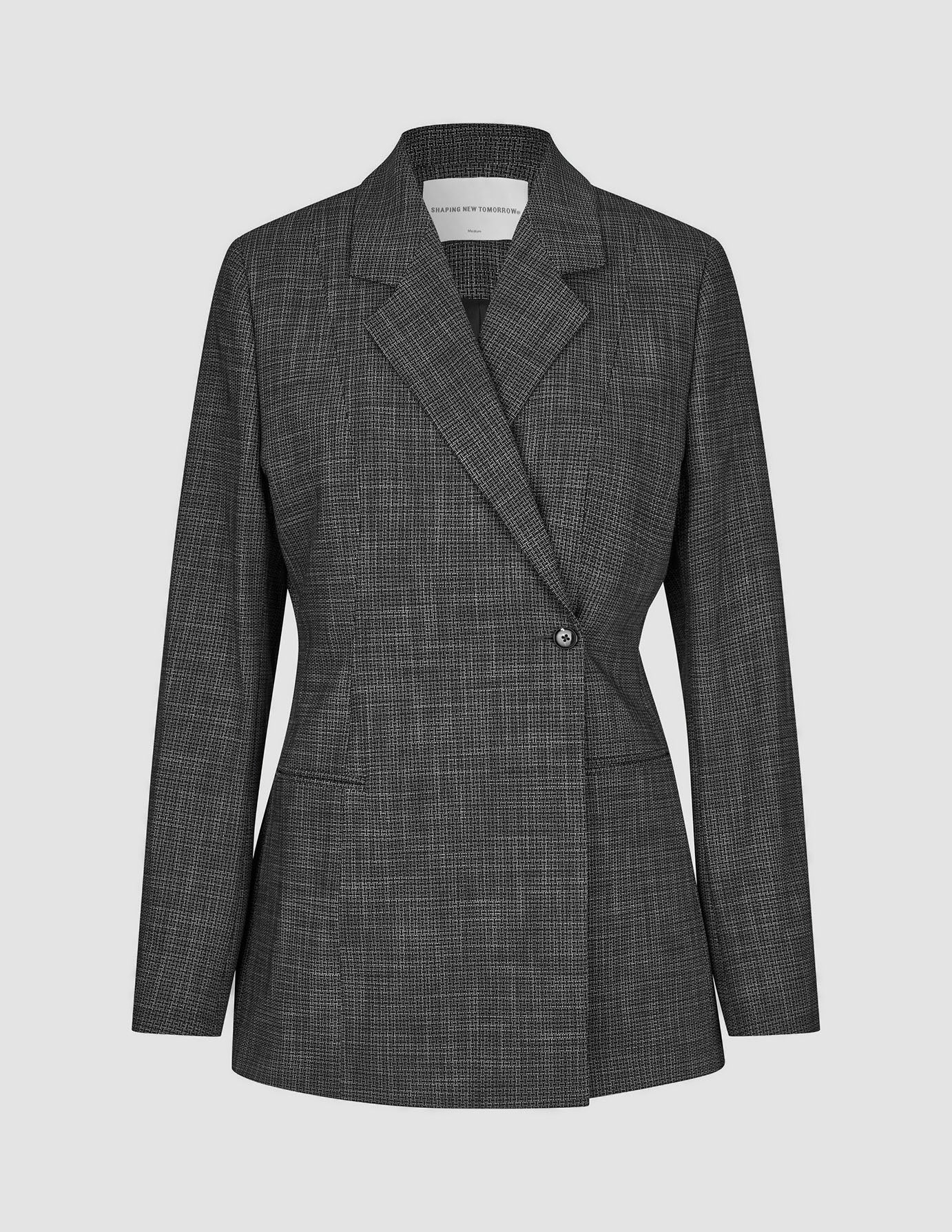 Nara-blazer til kvinder, tætsiddende, sort ternet – en sort-hvid ternet, tætsiddende blazer med én knap og 360°-stretch.